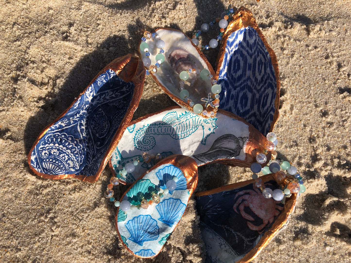 Gems in the Sand Oyster Shell
